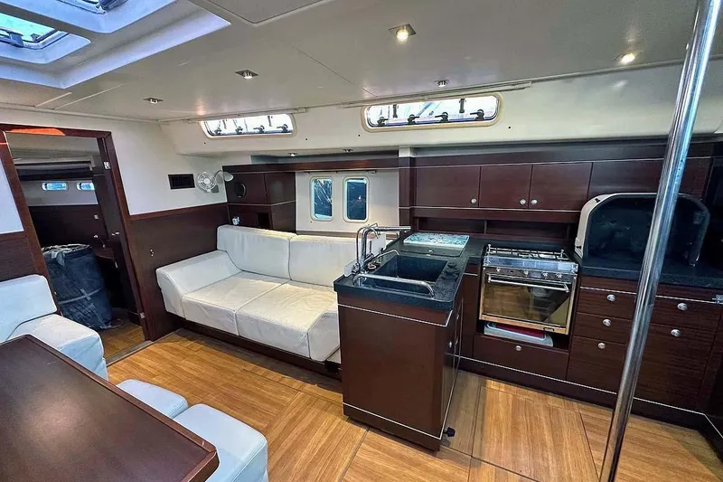 Slide: The Image of Luxurious interior of 2010 Hanse 545 yacht with modern kitchen and seating area. - 19