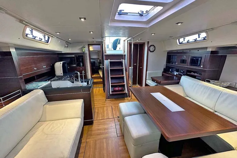 Slide: The Image of Luxurious interior of 2010 Hanse 545 yacht with modern kitchen and dining area. - 20