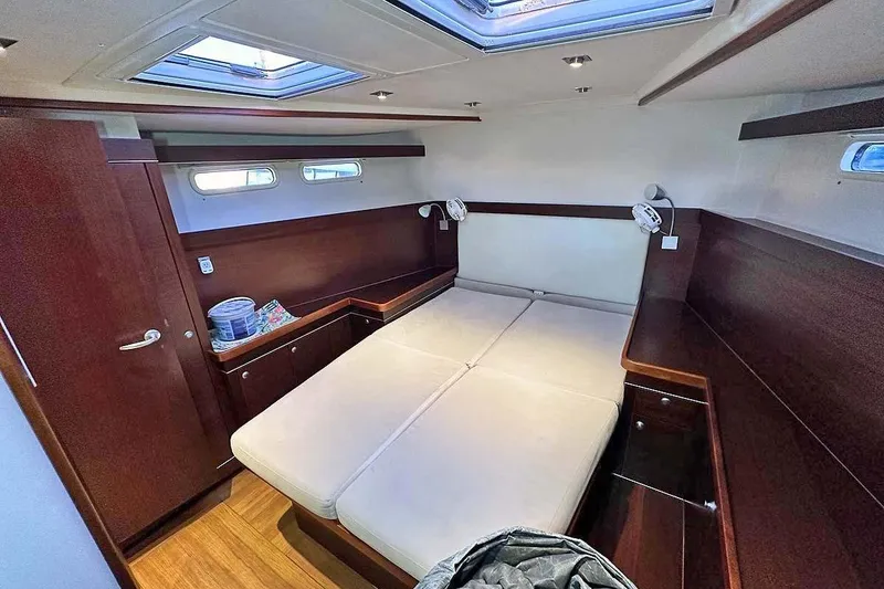Slide: The Image of Luxurious cabin interior of 2010 Hanse 545 yacht with wooden finish and skylight. - 28