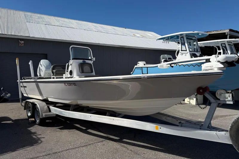 The Image of 2021 Sea Born FX24 Bay boat on trailer, parked outdoors. - 1