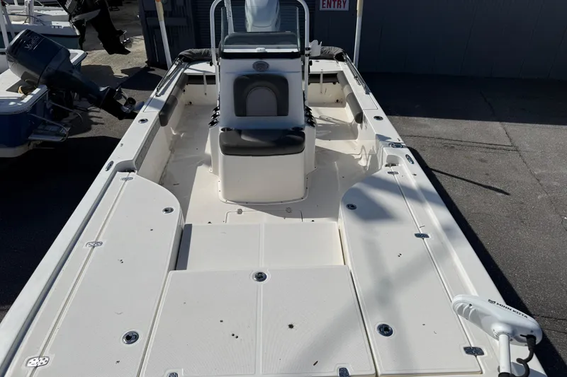 Slide: The Image of 2021 Sea Born FX24 Bay boat interior with center console and seating. - 11