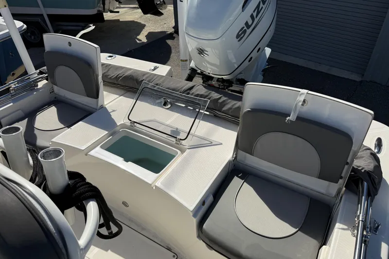 Slide: The Image of 2021 Sea Born FX24 Bay boat interior with seating and storage compartments. - 15