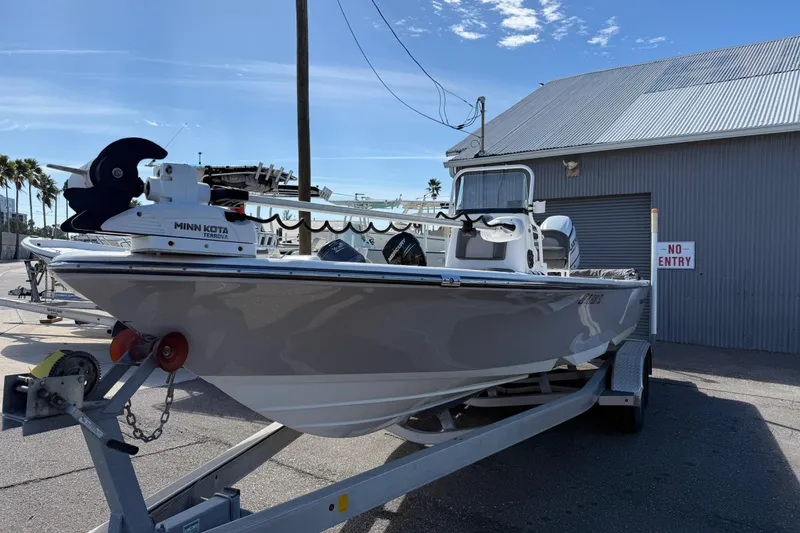 Slide: The Image of 2021 Sea Born FX24 Bay boat on trailer, equipped with Minn Kota trolling motor. - 3