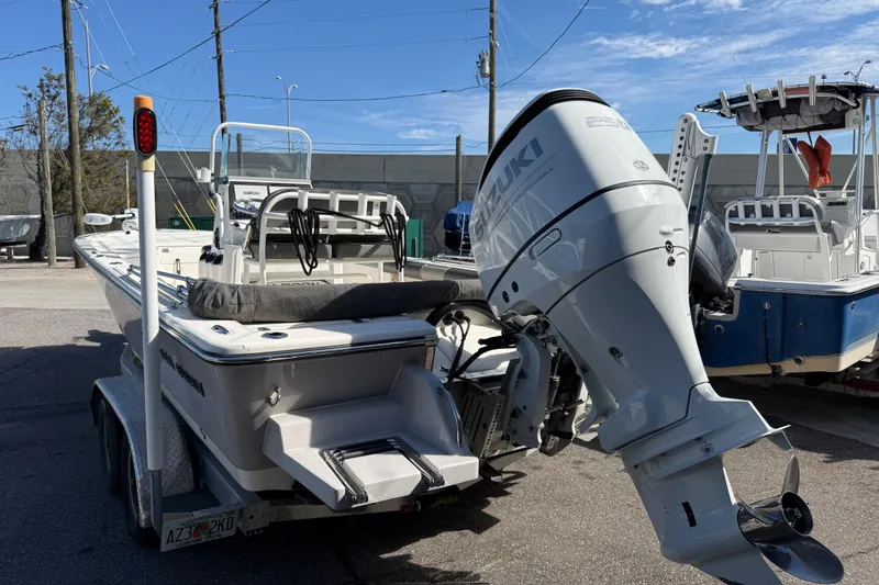 Slide: The Image of 2021 Sea Born FX24 Bay boat with Suzuki outboard motor on trailer. - 5