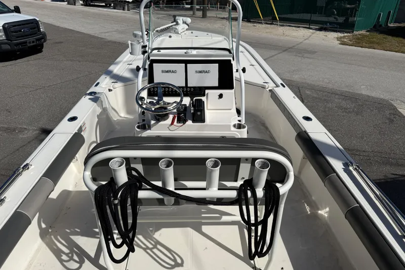 Slide: The Image of 2021 Sea Born FX24 Bay boat interior with steering console and Simrad electronics. - 7