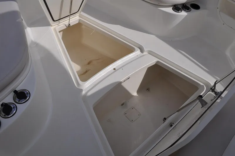 Slide: The Image of Storage compartments on a 2006 Boston Whaler 320 Outrage boat. - 17