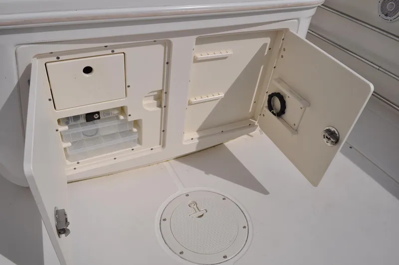 Slide: The Image of Storage compartment in 2006 Boston Whaler 320 Outrage boat. - 19