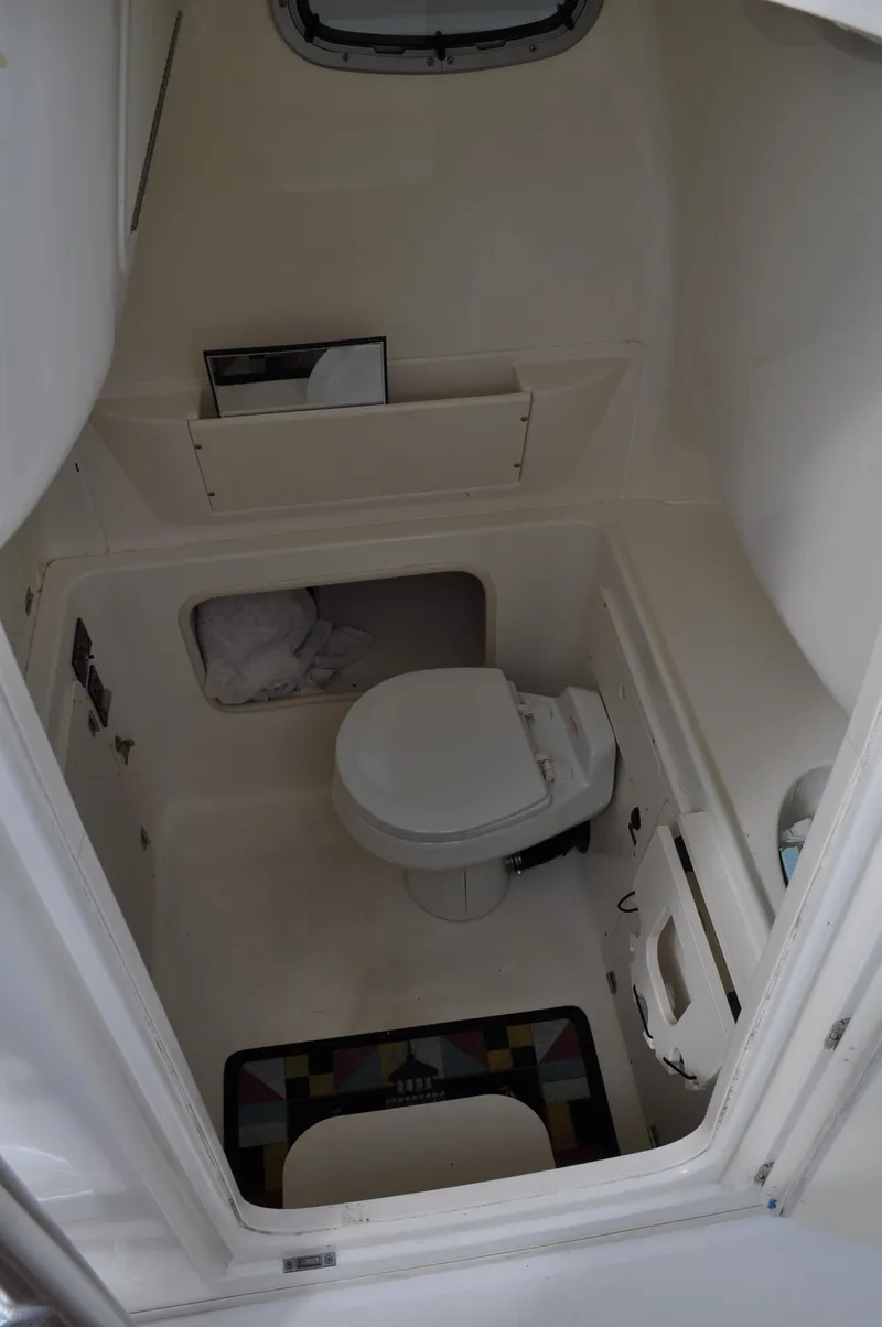 Slide: The Image of Interior of 2006 Boston Whaler 320 Outrage with toilet. - 21