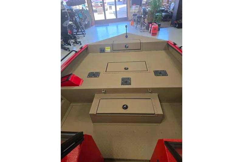 Slide: The Image of Interior view of 2026 SeaArk Protege 240 boat cockpit with red dashboard and steering wheel. - 4