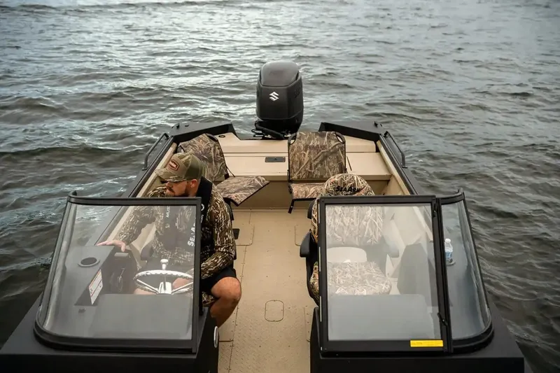 Slide: The Image of 2026 SeaArk Protege 240 boat interior with storage compartments and red accents. - 9