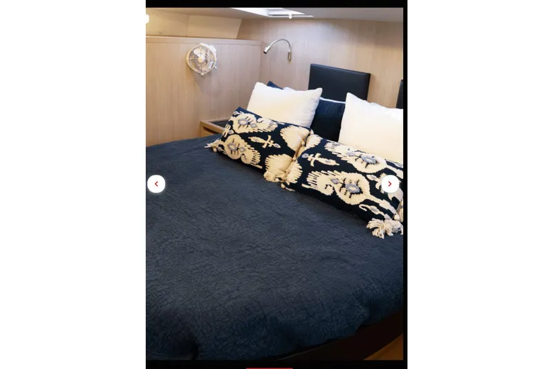 Slide: The Image of Luxurious bedroom interior of 2018 Aquila 44 Yacht with elegant bedding and decor. - 10