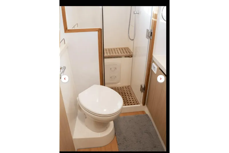 Slide: The Image of Bathroom interior of 2018 Aquila 44 Yacht, featuring toilet and shower area. - 12