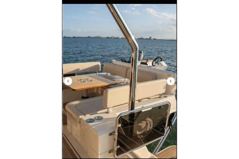 Slide: The Image of Aquila 44 Yacht 2018, featuring a sleek deck with seating and ocean view. - 18