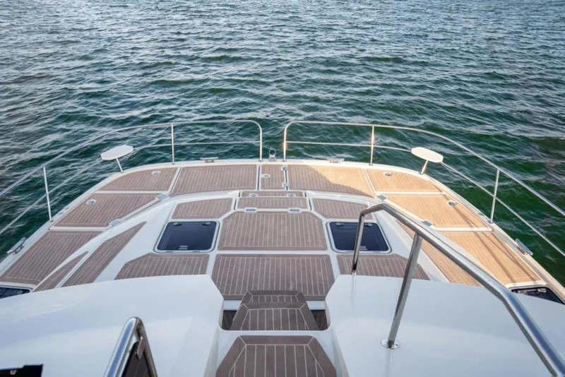 Slide: The Image of 2018 Aquila 44 Yacht deck overlooking calm ocean waters. - 22