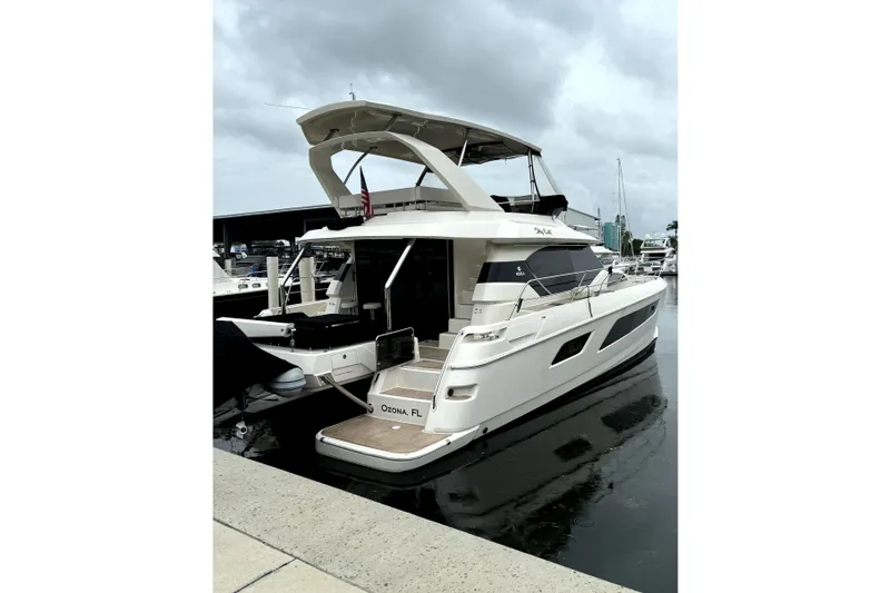 Slide: The Image of 2018 Aquila 44 Yacht docked in marina, overcast sky, Ozona, FL. - 25