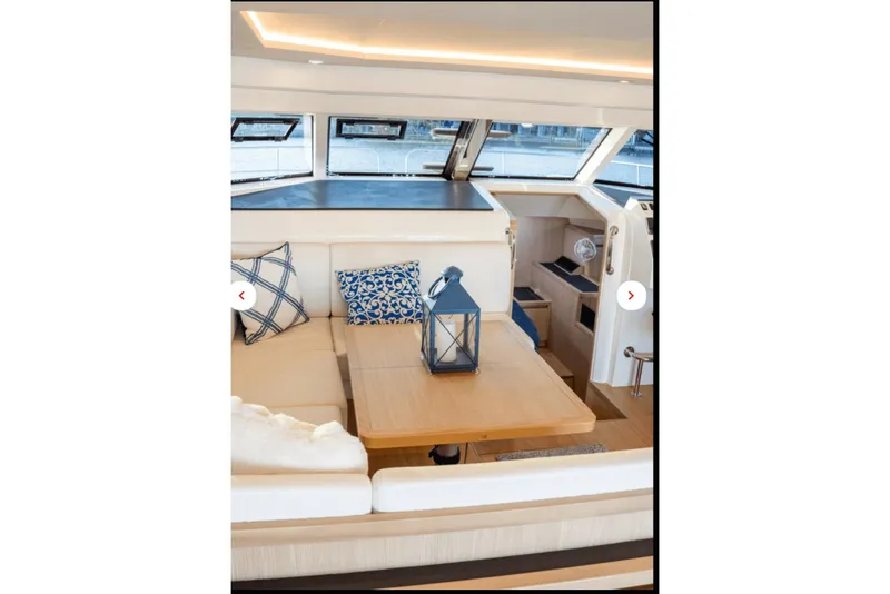 Slide: The Image of Interior of 2018 Aquila 44 Yacht with cozy seating and decorative pillows. - 7