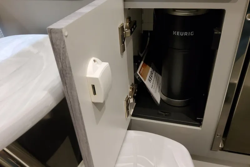 Slide: The Image of Cabinet with Keurig coffee maker inside Formula 360 Crossover Bowrider OB, 2026 model. - 103