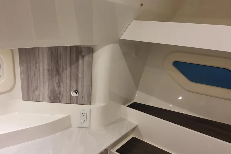 Slide: The Image of Interior of 2026 Formula 360 Crossover Bowrider OB, featuring modern cabinetry and sleek design. - 109