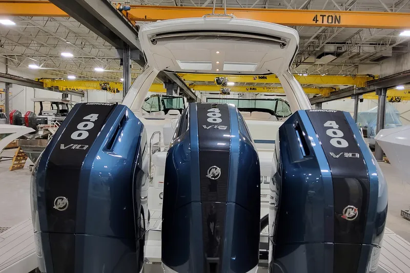 Slide: The Image of 2026 Formula 360 Crossover Bowrider OB with triple Mercury 400 V10 engines in a workshop. - 11