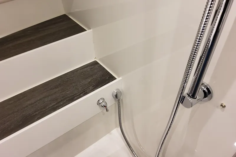 Slide: The Image of Interior of 2026 Formula 360 Crossover Bowrider OB, featuring sleek steps and chrome fixtures. - 114