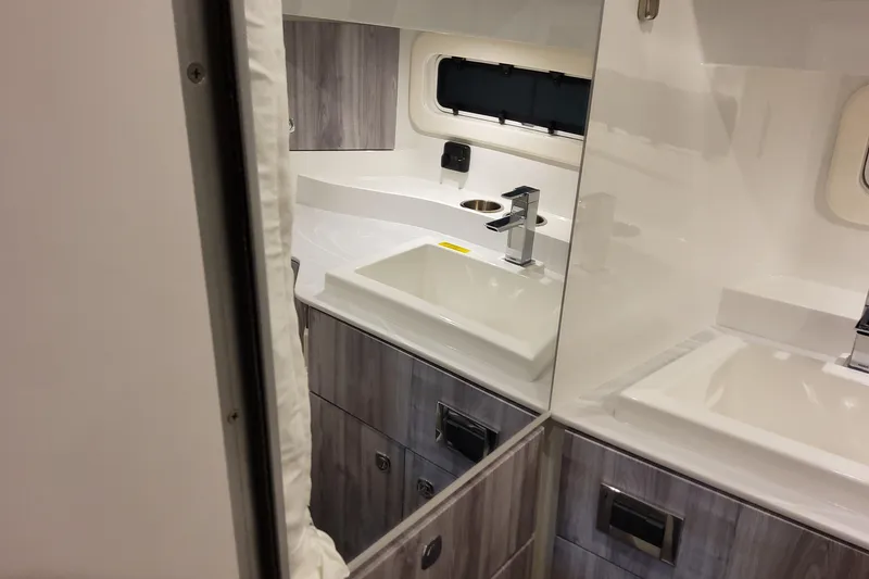 Slide: The Image of Interior of 2026 Formula 360 Crossover Bowrider OB, featuring modern bathroom design. - 115