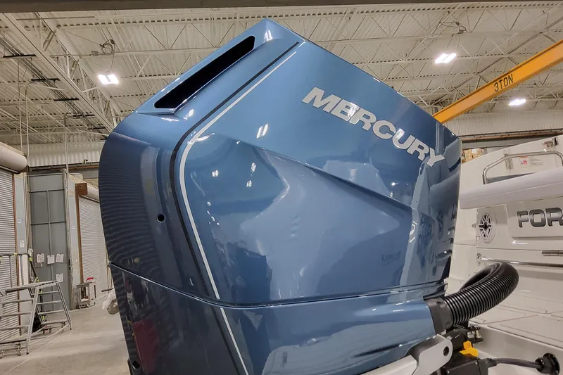 Slide: The Image of 2026 Formula 360 Crossover Bowrider OB with Mercury outboard engine in a warehouse. - 12