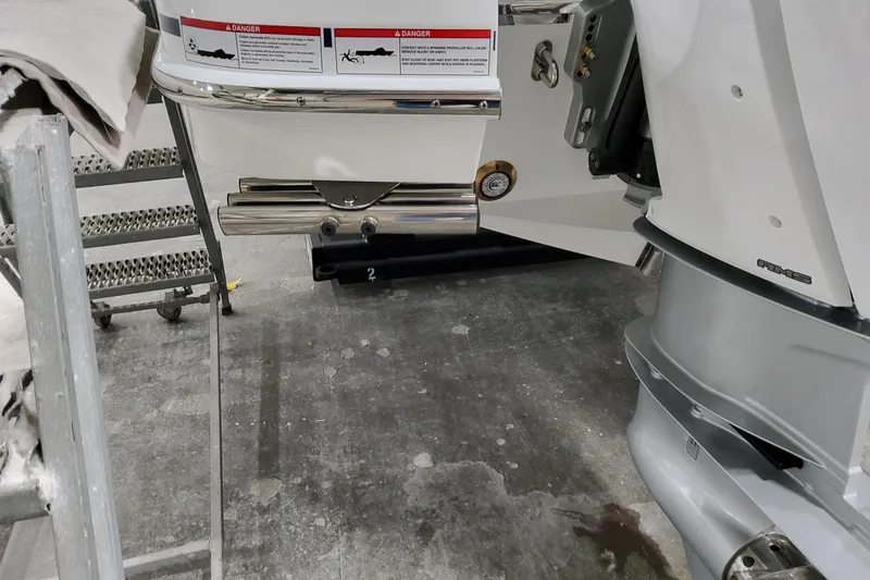 Slide: The Image of 2026 Formula 360 Crossover Bowrider OB boat engine detail in a workshop setting. - 16