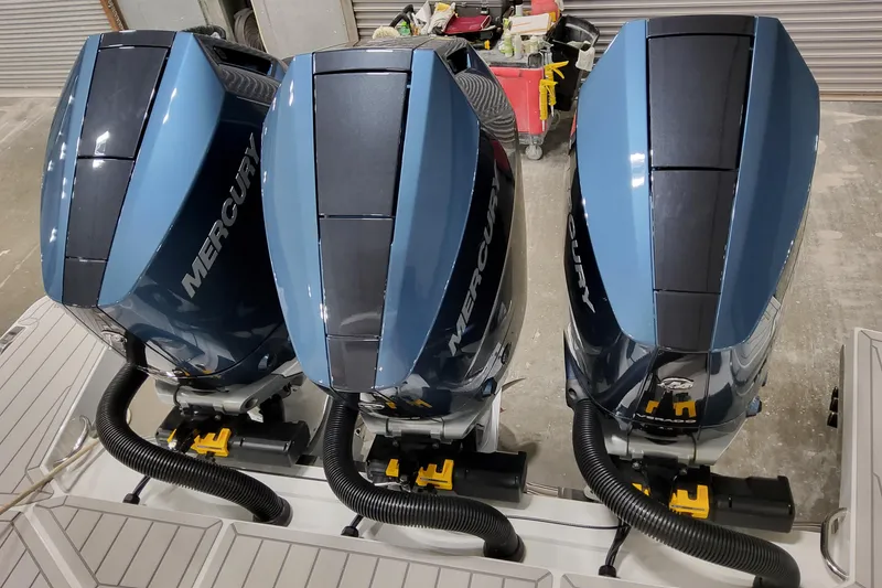 Slide: The Image of Triple Mercury outboard engines on a 2026 Formula 360 Crossover Bowrider OB boat. - 17