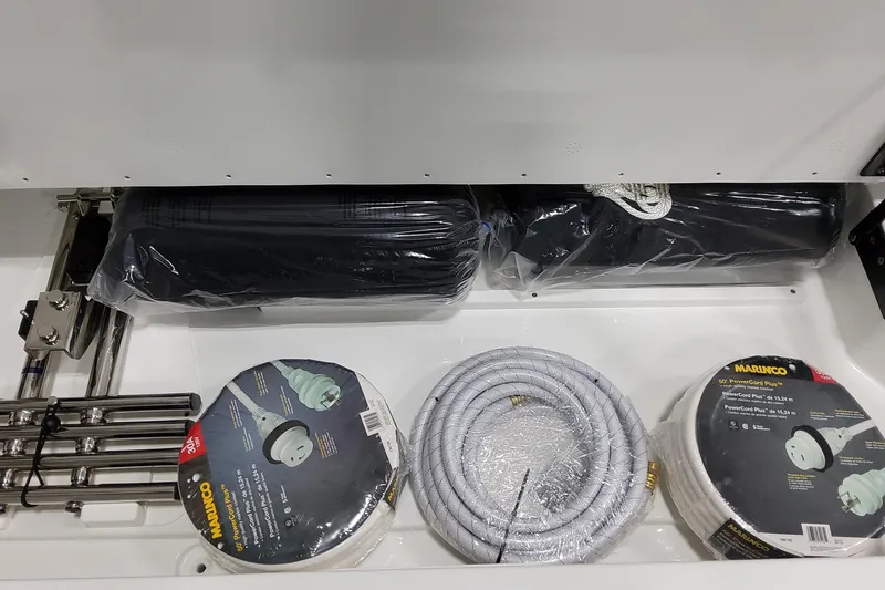 Slide: The Image of Storage compartment of 2026 Formula 360 Crossover Bowrider OB with marine accessories. - 22