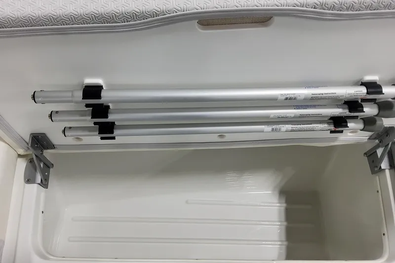 Slide: The Image of Storage compartment in 2026 Formula 360 Crossover Bowrider OB with secured poles. - 42