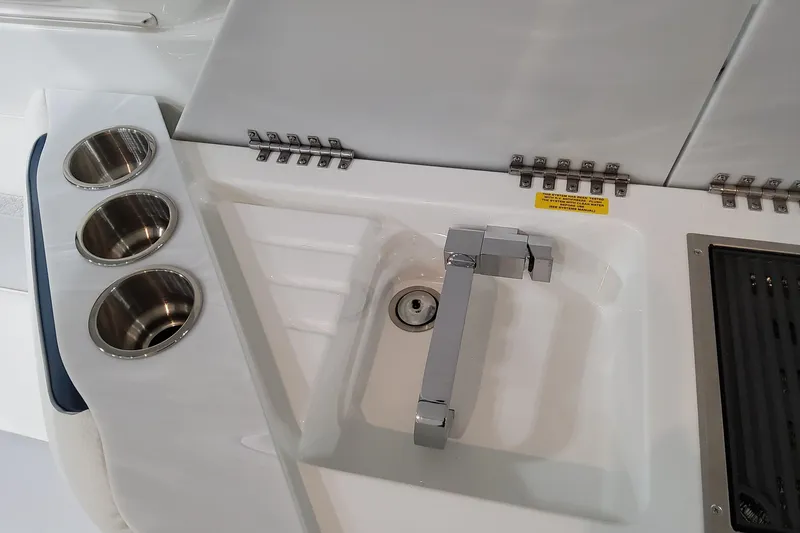 Slide: The Image of 2026 Formula 360 Crossover Bowrider OB sink and cup holders on deck. - 48