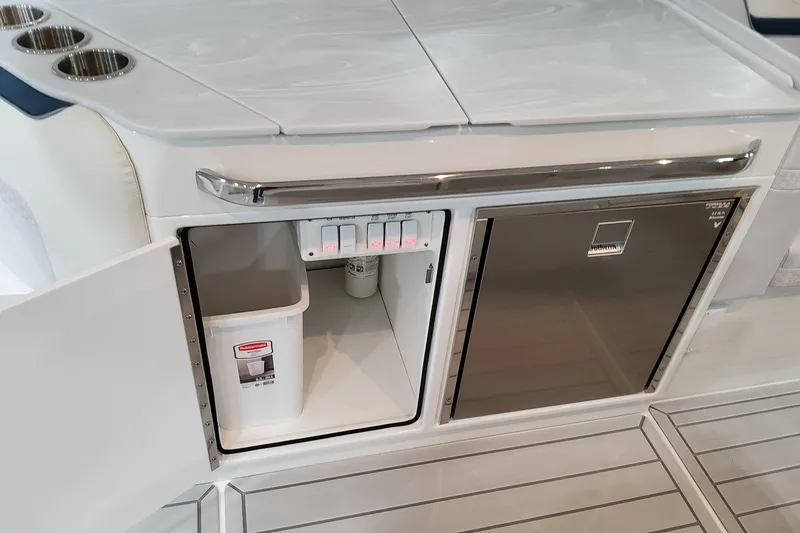 Slide: The Image of 2026 Formula 360 Crossover Bowrider OB interior with storage and mini fridge. - 49