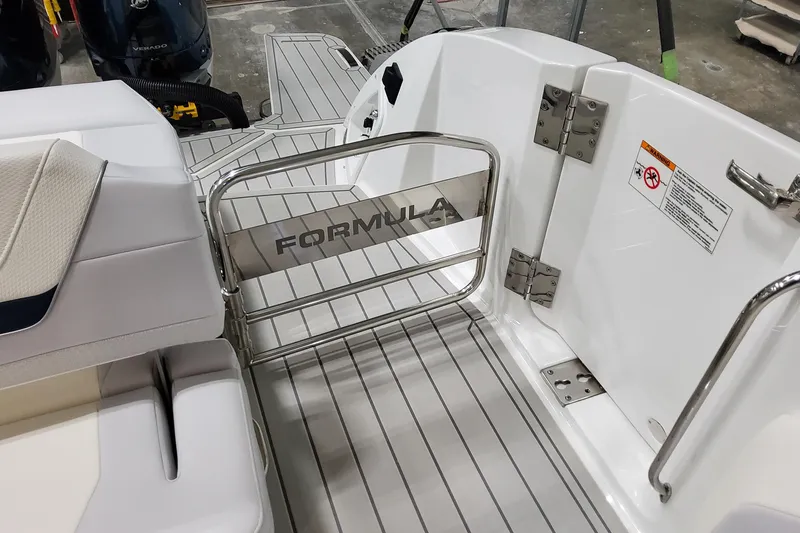 Slide: The Image of 2026 Formula 360 Crossover Bowrider OB boat interior with branded gate and seating. - 53