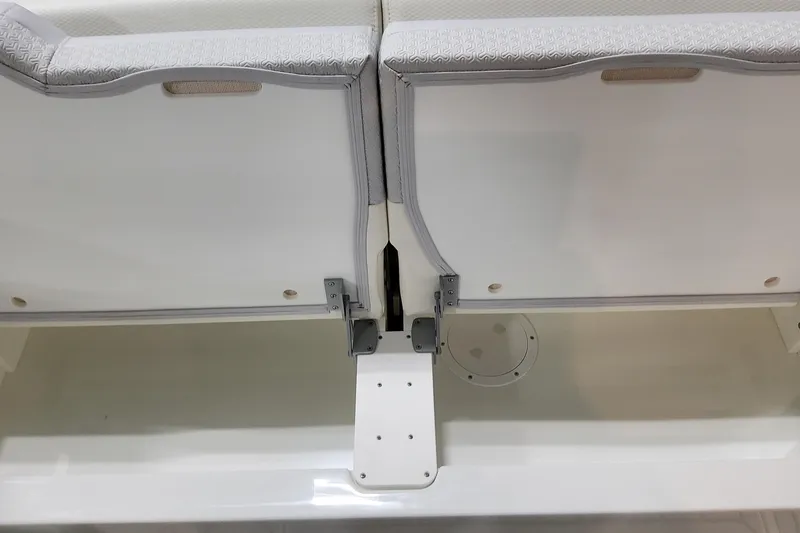 Slide: The Image of 2026 Formula 360 Crossover Bowrider OB seating detail with white upholstery and storage compartment. - 66