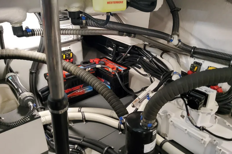 Slide: The Image of Engine compartment of 2026 Formula 360 Crossover Bowrider OB with wiring and batteries. - 77