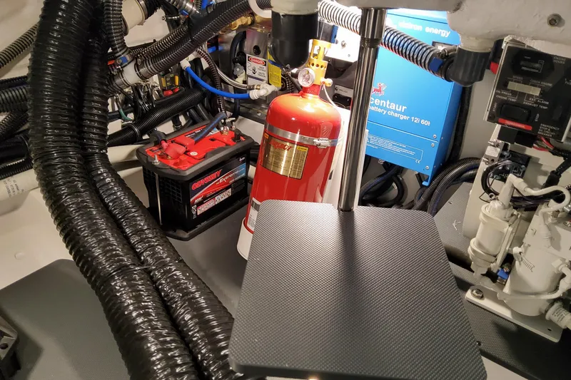 Slide: The Image of Engine compartment of 2026 Formula 360 Crossover Bowrider OB with battery and fire extinguisher. - 79