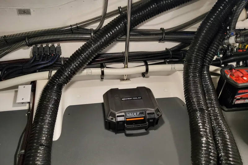 Slide: The Image of Engine compartment of 2026 Formula 360 Crossover Bowrider OB with wiring and tool kit. - 80