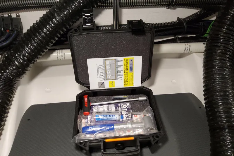 Slide: The Image of Tool kit inside Formula 360 Crossover Bowrider OB, 2026 model, with maintenance instructions. - 82