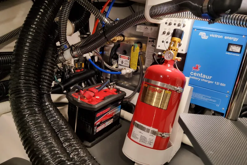 Slide: The Image of Engine room of 2026 Formula 360 Crossover Bowrider OB with battery and fire extinguisher. - 83