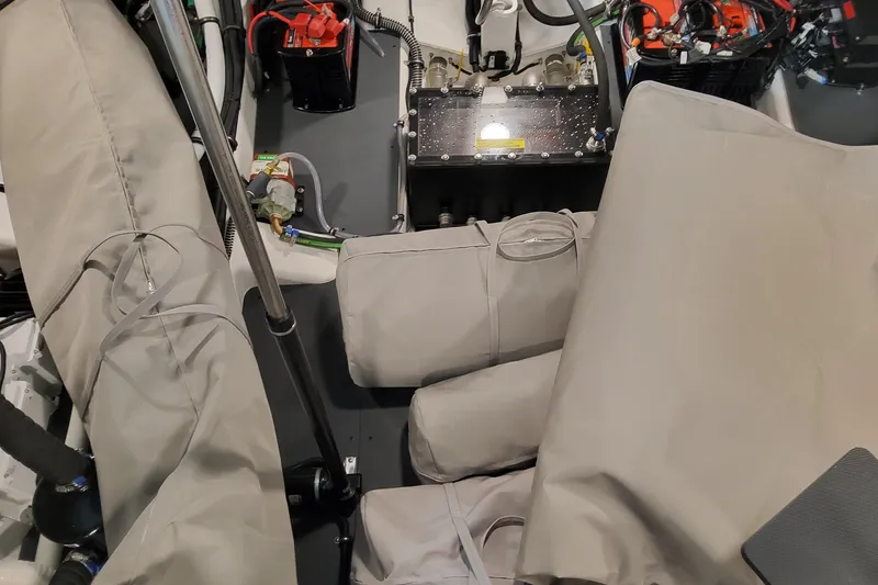 Slide: The Image of 2026 Formula 360 Crossover Bowrider OB engine compartment with protective covers and battery setup. - 86