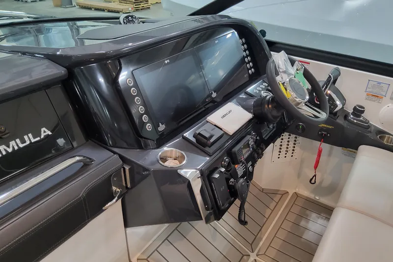 Slide: The Image of 2026 Formula 360 Crossover Bowrider OB helm with advanced controls and navigation displays. - 88