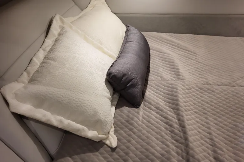 Slide: The Image of Luxurious bedding in 2026 Formula 360 Crossover Bowrider OB cabin, featuring plush pillows and quilted blanket. - 89