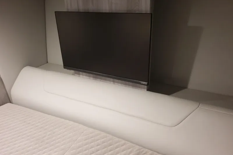 Slide: The Image of Modern interior of 2026 Formula 360 Crossover Bowrider OB with TV and white seating. - 90