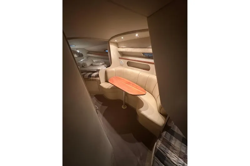 Slide: The Image of 2000 Cruisers Yachts 2870 Express cockpit with steering wheel and control panel. - 10