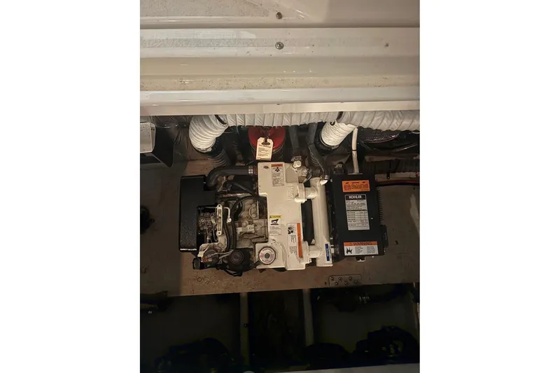 Slide: The Image of Engine compartment of 2000 Cruisers Yachts 2870 Express, featuring Kohler generator. - 20