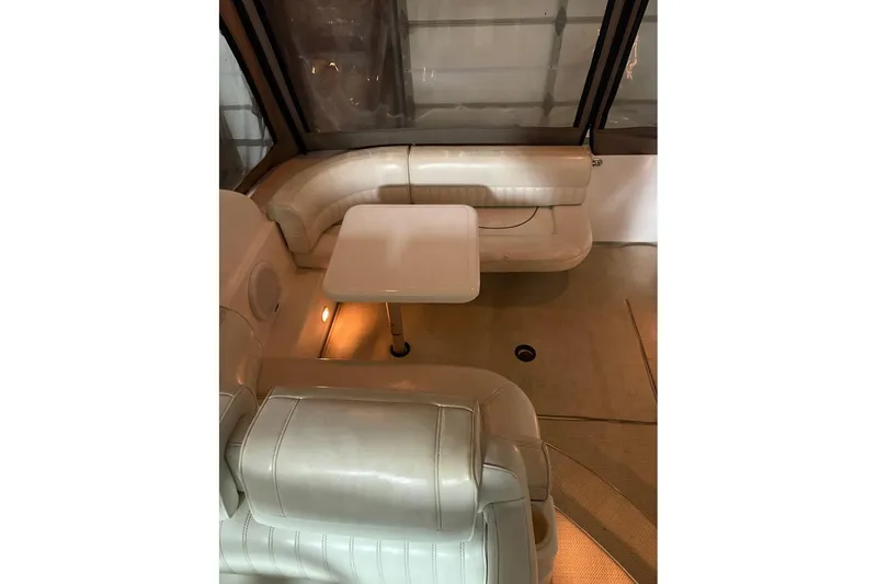 Slide: The Image of 2000 Cruisers Yachts 2870 Express in storage, side view with covered cockpit. - 5