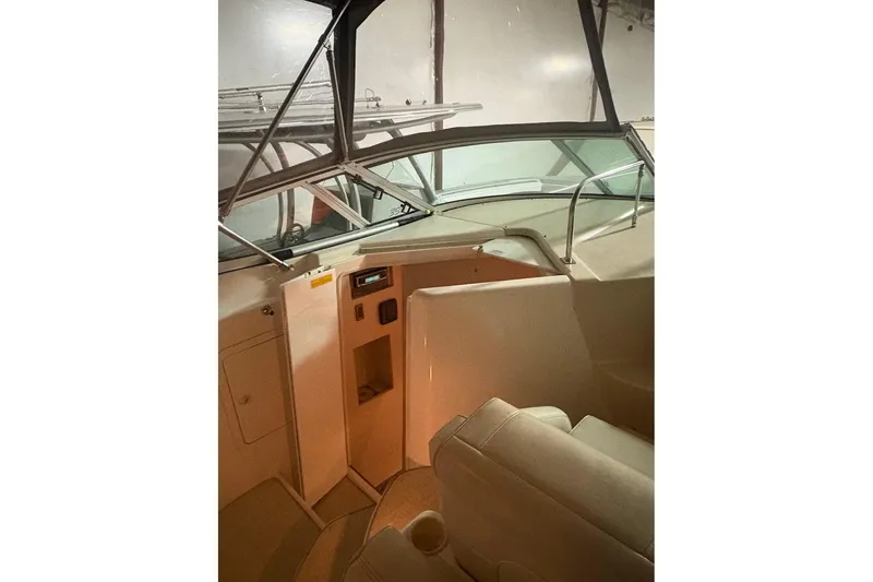 Slide: The Image of 2000 Cruisers Yachts 2870 Express in indoor storage, side view. - 7