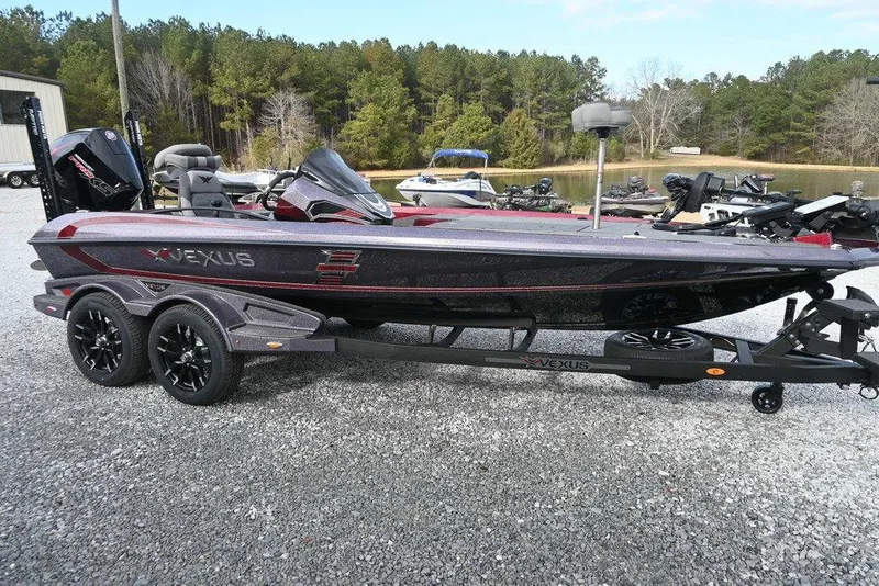 The Image of 2026 Vexus VXs20 boat on trailer, parked outdoors near a lake. - 1
