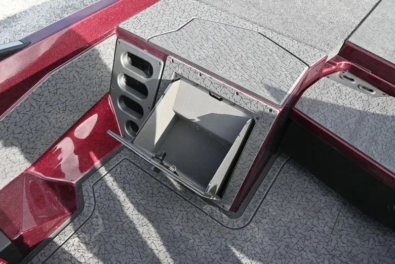Slide: The Image of 2026 Vexus VXs20 boat storage compartment with textured flooring and maroon accents. - 11