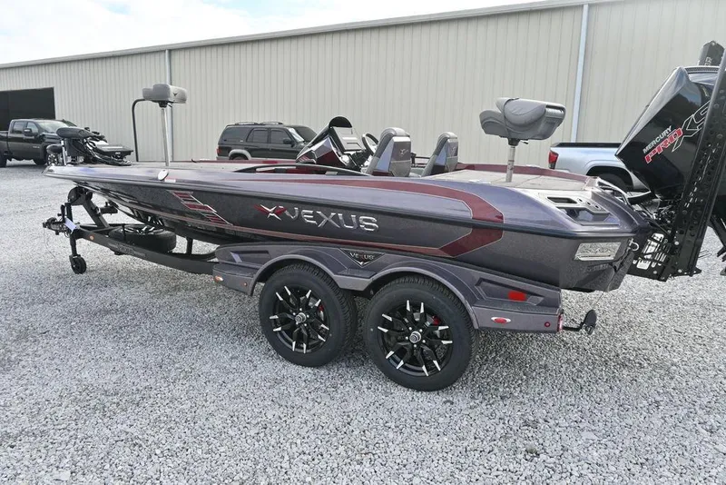 Slide: The Image of 2026 Vexus VXs20 boat on trailer, sleek design, parked on gravel. - 8